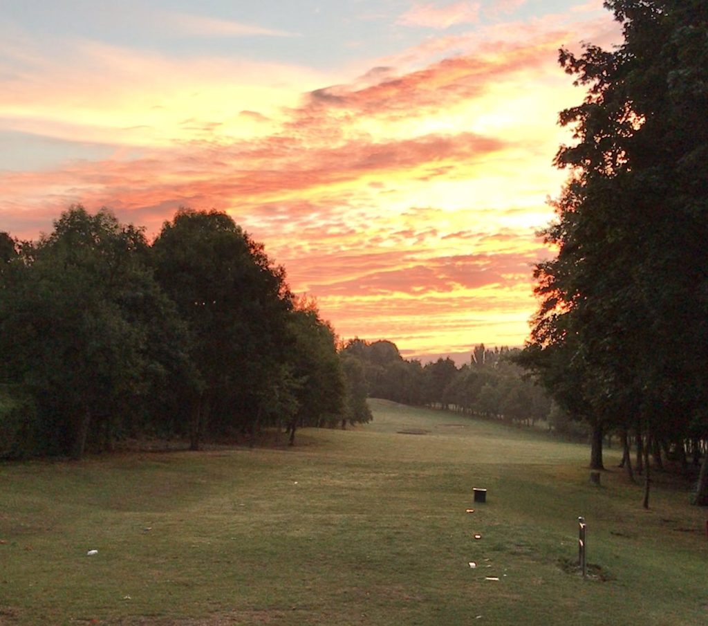 A tree-lined fairway at Pastures Golf Club
